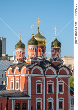 Domes of Church of St George the Victorious or Church of the Holy Great Martyr George on Pskov Mount on Varvarka street in Moscow and blue sky on background 84999777