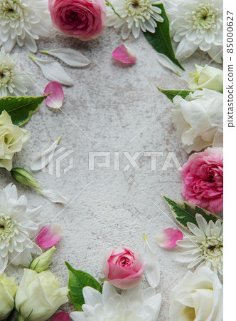 Frame made of pink flowers on concrete background. Frame made of pink flowers on concrete background. 85000627