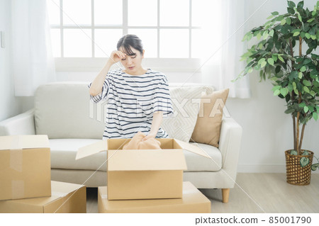 Japanese woman tired of moving work and packing Japanese woman tired of moving work and packing 85001790