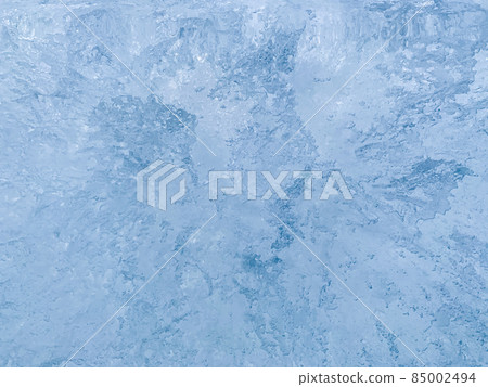 Textured ice background with divergent waves. 85002494
