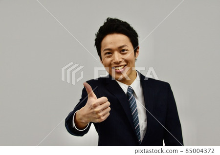 Young man doing goo sign Young man doing goo sign 85004372