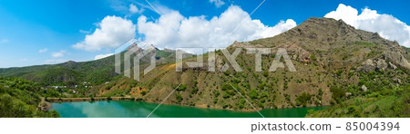 Beautiful sunny valley between the mountains with lush clouds in the Crimea, Ukraine Beautiful sunny valley between the mountains with lush clouds in the Crimea, Ukraine 85004394