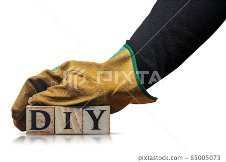 Hand with Work Gloves Holding Text Diy made of Wooden Blocks Hand with Work Gloves Holding Text Diy made of Wooden Blocks 85005073