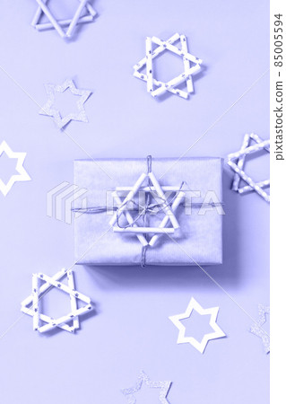 Jewish holiday Hanukkah. A gift and symbol of Hanukkah star of David. 85005594