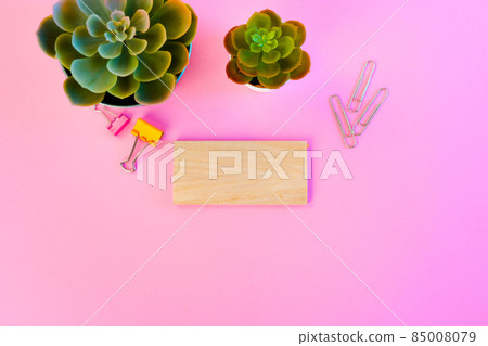 Top view of wooden block with copy space on pink background 85008079