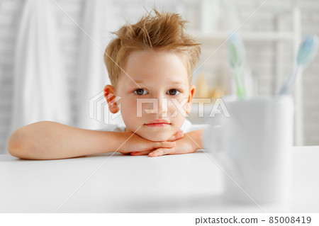 Little boy portrait standing in a bathroom 85008419