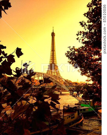 Eiffel Tower at dusk overlooking the banks of the Seine Eiffel Tower at dusk overlooking the banks of the Seine 85010886