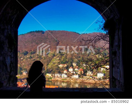 A woman overlooking Heidelberg from the castle 85010902