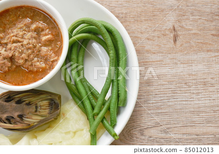 spicy mashed mackerel and fermenting fish chili sauce paste eat couple boiled vegetable on plate spicy mashed mackerel and fermenting fish chili sauce paste eat couple boiled vegetable on plate 85012013