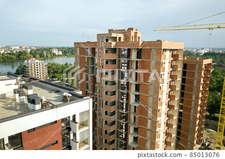 Aerial view of tall residential apartment buildings under construction. Real estate development. 85013076