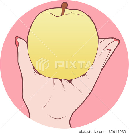 Female hand with a yellow apple Female hand with a yellow apple 85013083