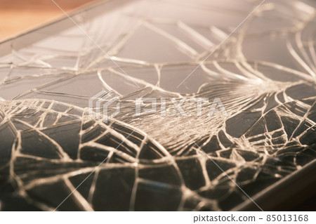Top view of broken smart phone on color background Top view of broken smart phone on color background 85013168