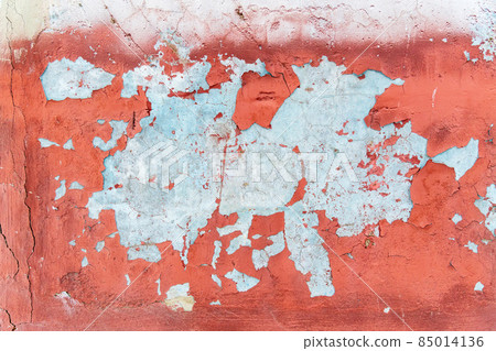 Old weathering cracks with peeling red paint smeared with cleaned wall texture. Old weathering cracks with peeling red paint smeared with cleaned wall texture. 85014136