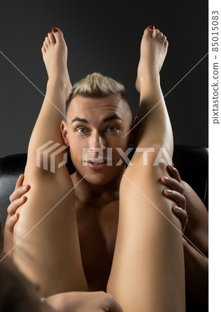 Couple enjoying foreplay in bed at home 85015083