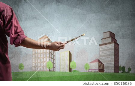 Close up artist hand holding paintbrush Close up artist hand holding paintbrush 85016086
