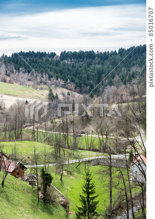View over the mountains, hills and colorful forests of Predjama, Slovenia View over the mountains, hills and colorful forests of Predjama, Slovenia 85016707