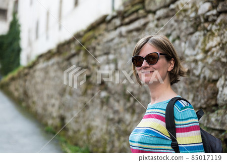 Portrait of a 30 year old female tourist in Skofja Loka, Slovenia Portrait of a 30 year old female tourist in Skofja Loka, Slovenia 85017119