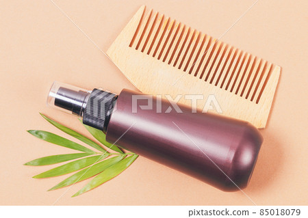 Wooden hair comb and natural cosmetic spray with green leaf Wooden hair comb and natural cosmetic spray with green leaf 85018079