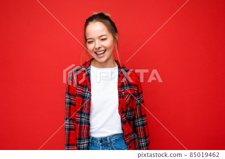 Portrait of young attractive smiling hipster blonde woman in stylish red shirt and casual white t Portrait of young attractive smiling hipster blonde woman in stylish red shirt and casual white t 85019462