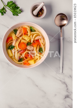 Chicken soup with noodles and vegetables 85019623