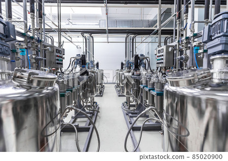 Photo of pipes and tanks. Chemistry and medicine production. Pharmaceutical factory. Interior of a 85020900