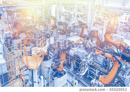 Photo of automobile production line. Welding car body. Modern car assembly plant. Top view in blue 85020952