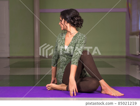 Lady demonstrating yoga asana 85021219