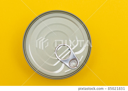 Unopened Tin Can with Blank Edge on Yellow Background Unopened Tin Can with Blank Edge on Yellow Background 85021831