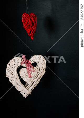 Valentine day love beautiful. Heart gaarland hanging on branch of tree on Valentine day love beautiful. Heart gaarland hanging on branch of tree on 85022192