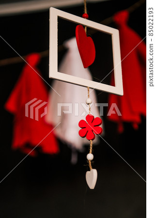 Valentine day love beautiful. Heart gaarland hanging on branch of tree on Valentine day love beautiful. Heart gaarland hanging on branch of tree on 85022193