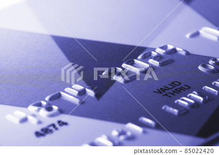 Fragment of credit card tinted in trendy color of 2022 by very peri Fragment of credit card tinted in trendy color of 2022 by very peri 85022420