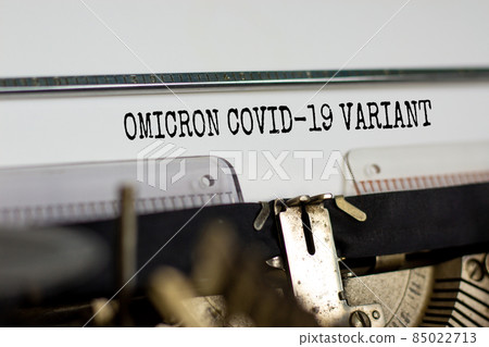 Covid-19 new omicron virus variant symbol. Concept words Omicron covid-19 variant typed on retro typewriter. Medical and COVID-19 pandemic new omicron variant strain mutation concept. 85022713