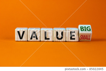 Small or big value symbol. Turned wooden cubes and changed words 'value small' to 'value big'. Beautiful orange background, copy space. Business and small or big value concept. Small or big value symbol. Turned wooden cubes and changed words 'value small' to 'value big'. Beautiful orange background, copy space. Business and small or big value concept. 85022845