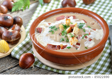 Delicious chestnut soup with celery, croutons and roasted bacon from South Tyrol 85022890