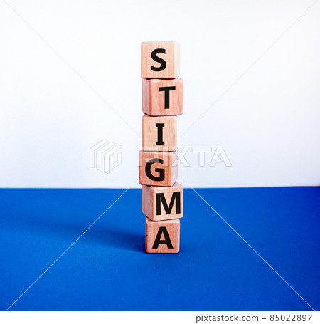 Stigma symbol. Wooden cubes with the word 'stigma'. Beautiful white and blue background. Psychological, medical, business and stigma concept. Copy space. 85022897