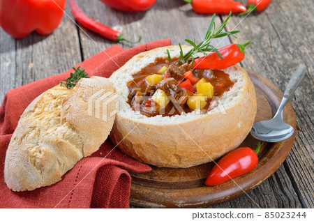 Hot Hungarian goulash soup in a loaf 85023244