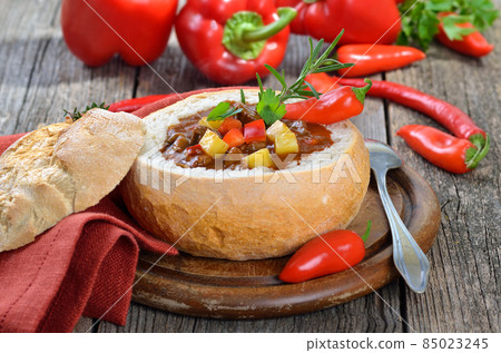 Hot Hungarian goulash soup in a loaf Hot Hungarian goulash soup in a loaf 85023245