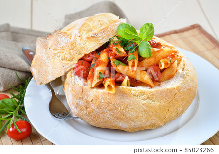 Pasta with tomato sauce filled in Italian ciabatta bread Pasta with tomato sauce filled in Italian ciabatta bread 85023266