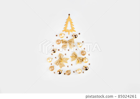 Simple minimalistic Christmas home decor of a wooden Christmas tree.Christmas, winter, new year concept. Simple minimalistic Christmas home decor of a wooden Christmas tree.Christmas, winter, new year concept. 85024261