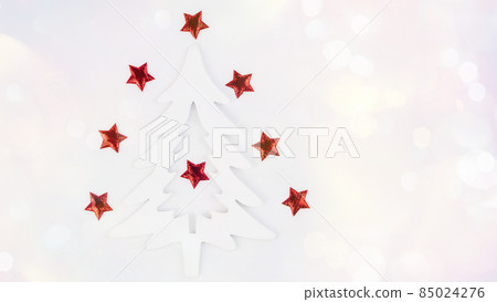Simple minimalistic Christmas home decor of a wooden Christmas tree.Christmas, winter, new year concept.Decorative wooden Christmas tree on a light background with New Year's decorations. Simple minimalistic Christmas home decor of a wooden Christmas tree.Christmas, winter, new year concept.Decorative wooden Christmas tree on a light background with New Year's decorations. 85024276