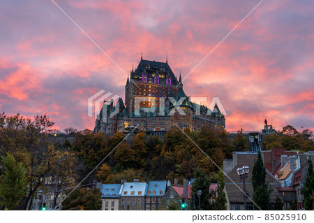 Quebec City Old Town street view in autumn dusk, stunning pink and yellow clouds over the sky in evening. Text in French is "Funicular". Quebec City Old Town street view in autumn dusk, stunning pink and yellow clouds over the sky in evening. Text in French is "Funicular". 85025910