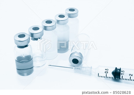 Vial of Drug and 3 ml Plastic Syringe with Needle Isolated on the White Background Vial of Drug and 3 ml Plastic Syringe with Needle Isolated on the White Background 85028628