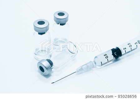 Vial of Drug, Vaccine and 3 ml Plastic Syringe with Needle Isolated on the White Background Vial of Drug, Vaccine and 3 ml Plastic Syringe with Needle Isolated on the White Background 85028656