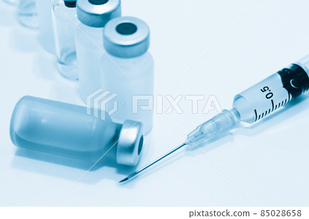 Vial of Drug, Vaccine and 3 ml Plastic Syringe with Needle Isolated on the White Background Vial of Drug, Vaccine and 3 ml Plastic Syringe with Needle Isolated on the White Background 85028658