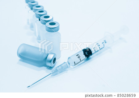 Vial of Drug, Vaccine and 3 ml Plastic Syringe with Needle Isolated on the White Background Vial of Drug, Vaccine and 3 ml Plastic Syringe with Needle Isolated on the White Background 85028659