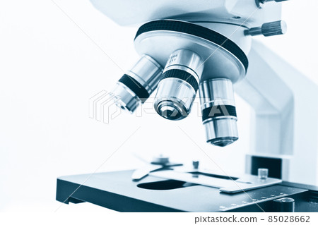 Objective Lens of Microscope Isolated on the White Background Objective Lens of Microscope Isolated on the White Background 85028662