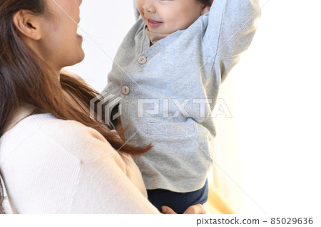 Image of mother and son (parent and child) hugging (high and high) Image of mother and son (parent and child) hugging (high and high) 85029636