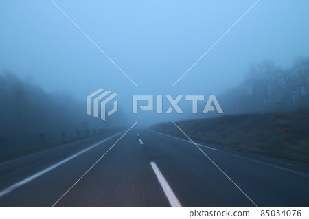 Early morning highway in the fog Early morning highway in the fog 85034076