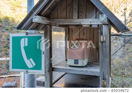 Nostalgic pink phone, public phone 85034672