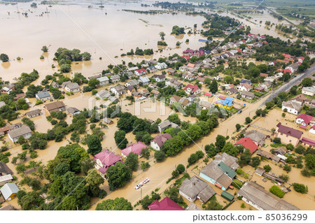 Aerial view of flooded houses with dirty water of Dnister river in Halych town, western Ukraine. 85036299
